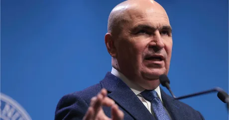 Ilie Bolojan discută despre importanța stabilității guvernamentale pentru România.
