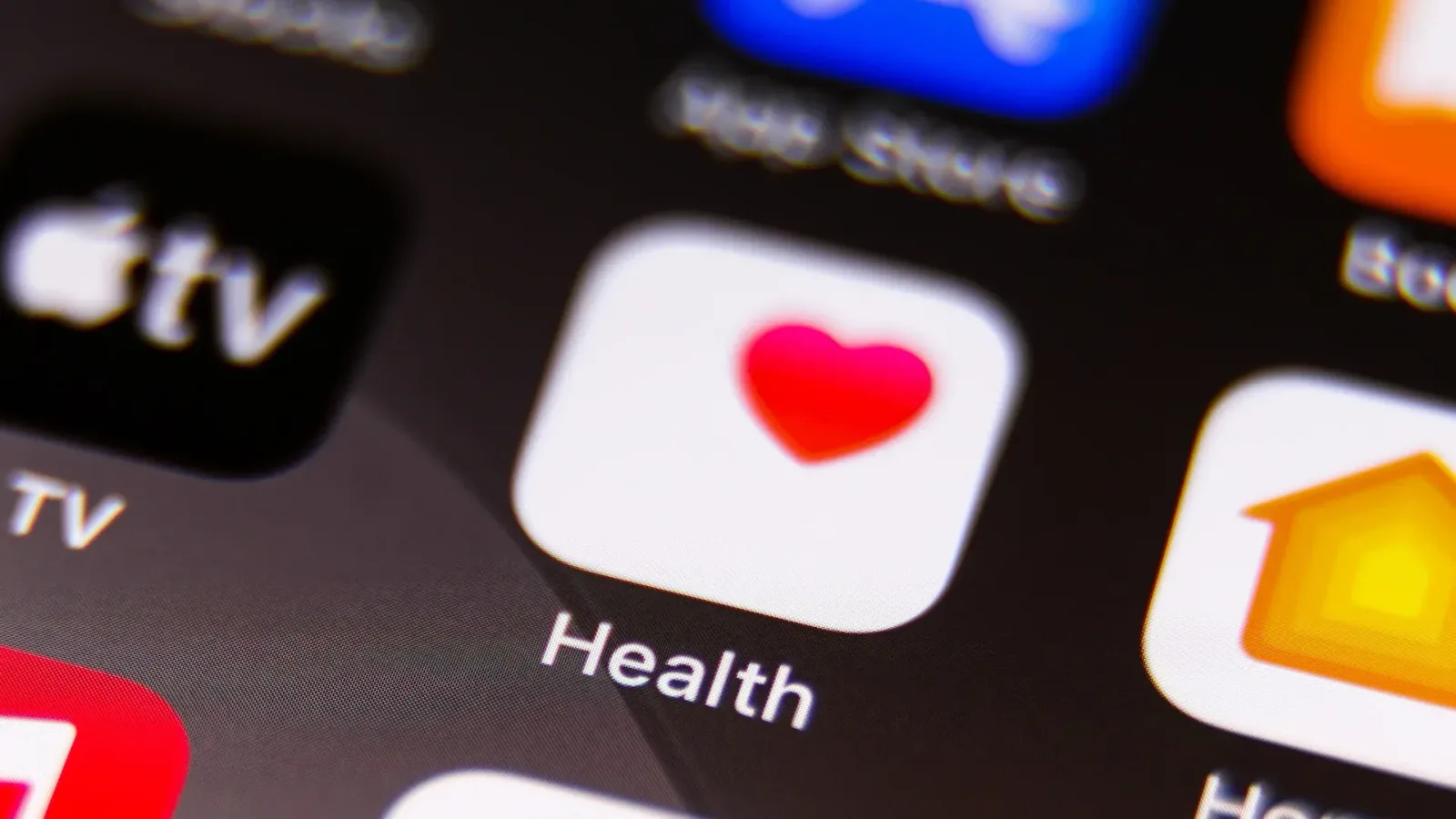 Logo-ul aplicației Health pe un ecran de telefon mobil.