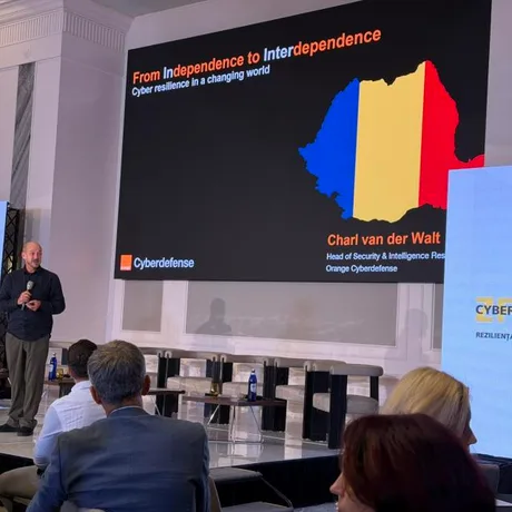 Prezentare despre reziliența cibernetică la conferința Orange Business.