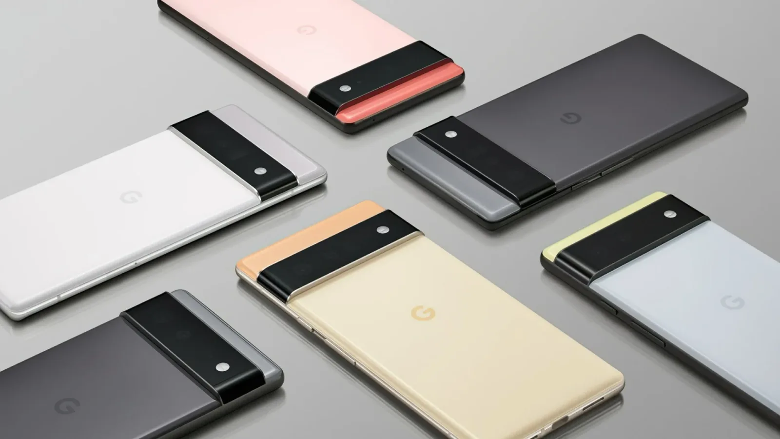 Telefoane Pixel 6 și 6 Pro, diverse culori, pe o suprafață netedă.