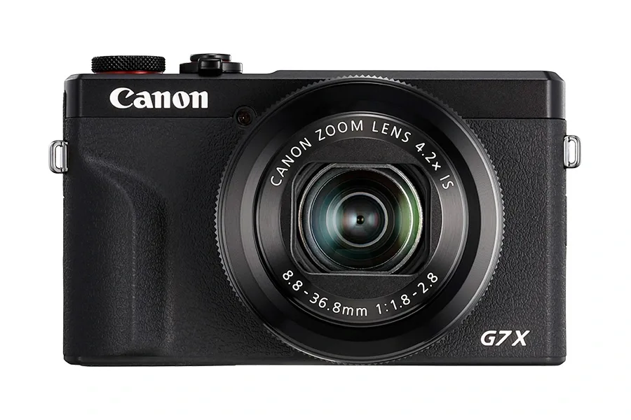 Aparat foto compact Canon PowerShot cu design modern și obiectiv versatil.