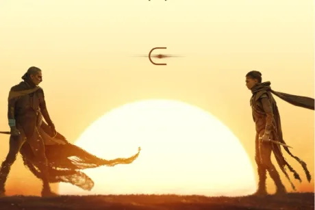 Două personaje se confruntă pe fundalul unui apus impresionant în universul Dune.