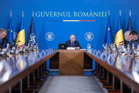 Ilie Bolojan discutând despre legea salarizării unitare în guvern.