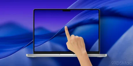 Un utilizator atinge ecranul unui laptop modern cu design elegant.