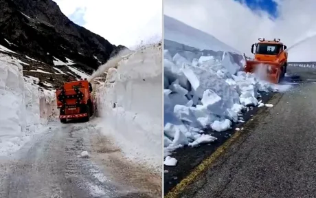 Un utilaj curăță zăpada de pe Transfăgărășan.
