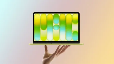 Laptop modern cu un design elegant, pe fundal pastelat.