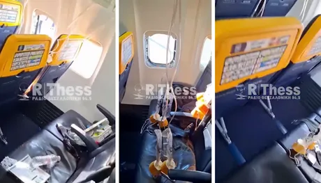 Interiorul aeronavei cu măști de oxigen căzute după depresurizare.