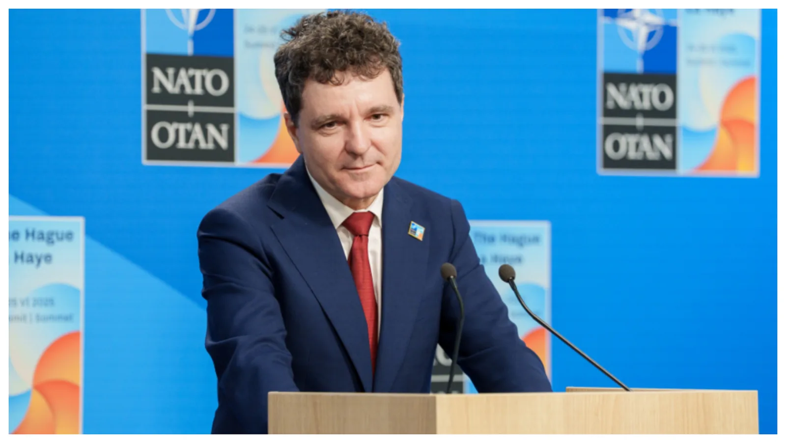 Nicușor Dan la Summitul NATO, discutând despre securitatea regională.