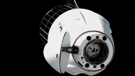 Capsula Dragon a SpaceX andocând la Stația Spațială Internațională pentru livrarea de echipamente.