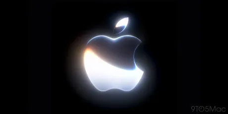 Logo Apple iluminat pe fundal întunecat, simbolizând inovația tehnologică.