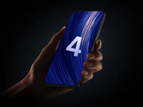 Un telefon mobil cu numărul 4 pe ecran, pe fundal întunecat.