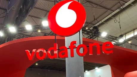 Logo Vodafone pe un fundal modern, simbolizând inovația în telecomunicații.