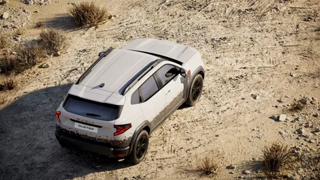 Dacia Duster parcata pe un teren nisipos, evidentiind designul robust al masinii.