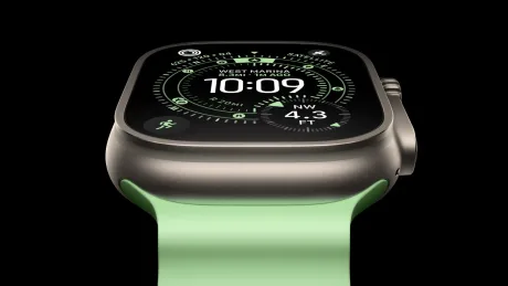 Apple Watch cu ecran OLED, design modern și curea verde deschis.