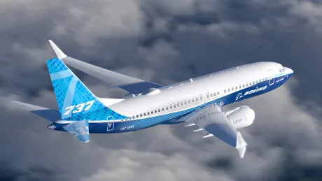 Avion Boeing 737 MAX 10 zburând printre nori, simbol al inovației aeronautice.