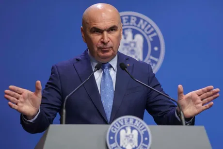 Ilie Bolojan discutând despre măsuri fiscale și deficitul bugetar.