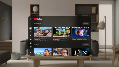 Interfața aplicației YouTube pe Apple Vision Pro, cu videoclipuri recomandate.