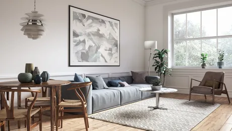 Un interior modern de apartament, cu mobilier confortabil și decor minimalist.
