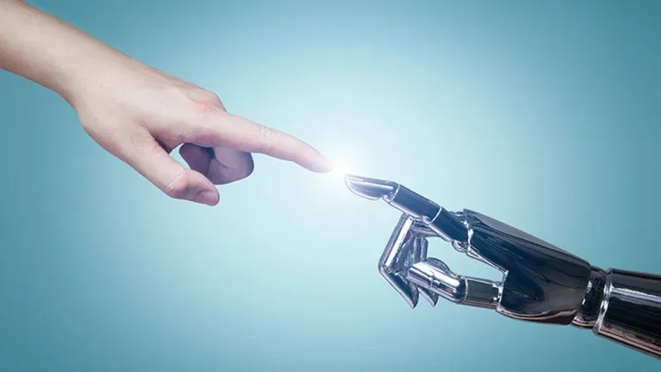 O mână umană atinge un deget robotic, simbolizând interacțiunea dintre oameni și AI.