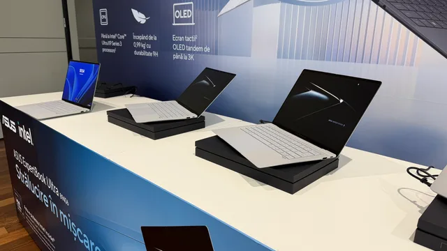Mai multe laptopuri ASUS ExpertBook Ultra aranjate pe un stand, cu ecran OLED.
