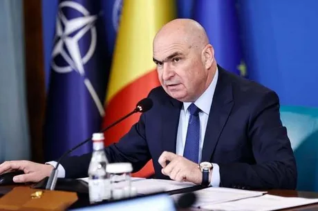 Ilie Bolojan discutând despre criza politică și bugetară în România.