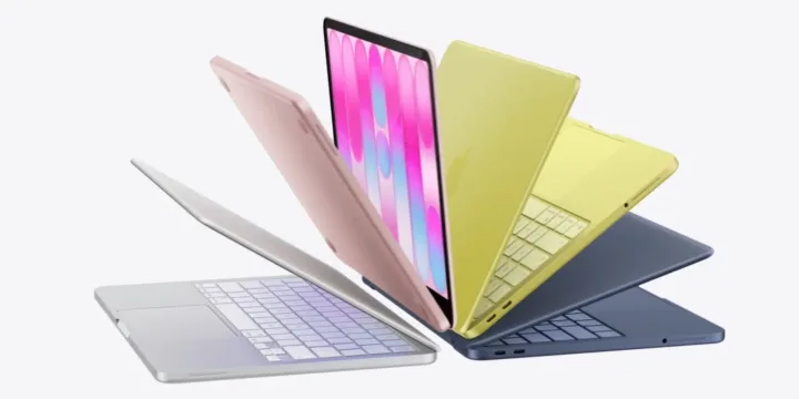 Laptopuri colorate aranjate artistic, evidențiind diversitatea designului Apple.