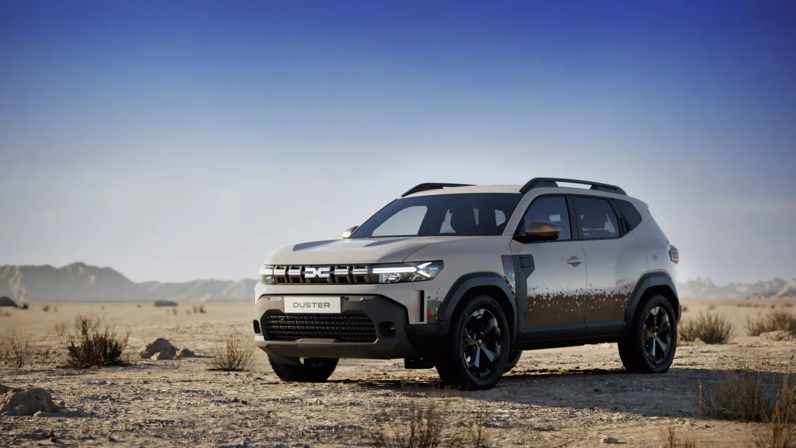 Un SUV Duster parcat pe un teren arid, sub un cer senin.