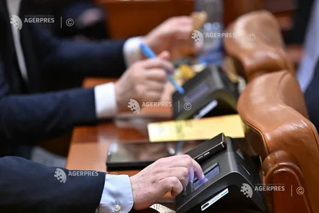 Deputații folosesc tablete pentru vot, dar se revine la votul fizic.