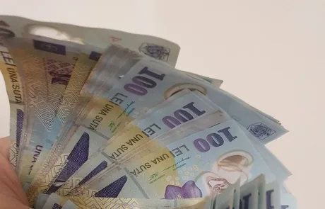 Bancnote de lei, simbolizând stabilitatea financiară pe piața interbancară.