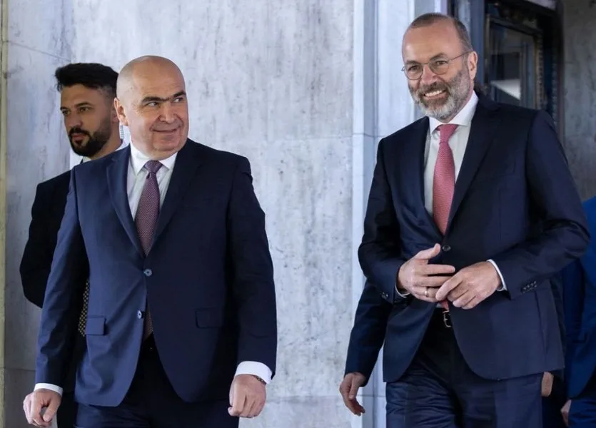 Manfred Weber și Ilie Bolojan discutând despre viitorul PNL și reformele necesare.
