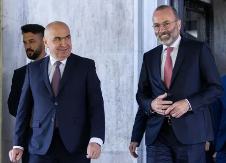 Manfred Weber și Ilie Bolojan discutând despre viitorul PNL și reformele necesare.