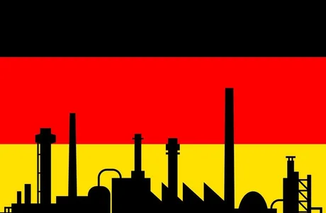 Silhouette de fabrici pe fundalul steagului Germaniei.