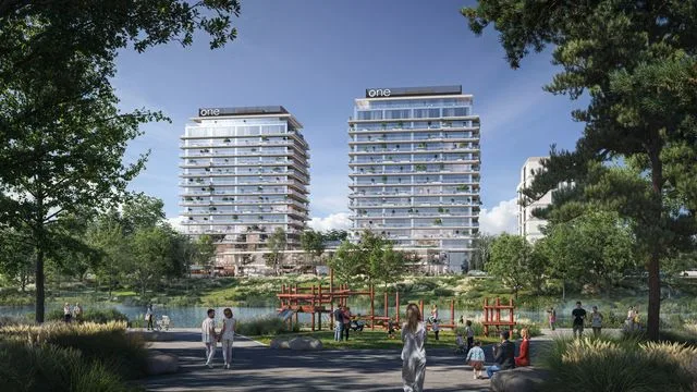 Proiect imobiliar modern cu clădiri și spații verzi în jur.